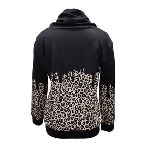 Detail view of leopard print patchwork and drawstring hem on women's casual sweatshirt