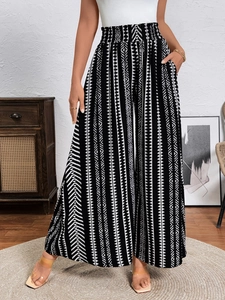 Women high waisted palazzo pants featuring black and white ethnic geometric patterns