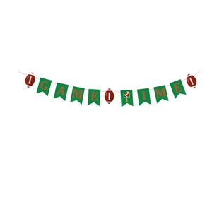 Detail of Game Time football party banner with green flags and brown football accents