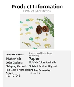 Detail of tropical animal and jungle leaf paper confetti in gold and green finishes