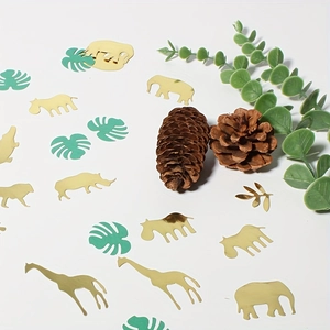 Golden jungle animal and tropical monstera leaf confetti for safari party decor