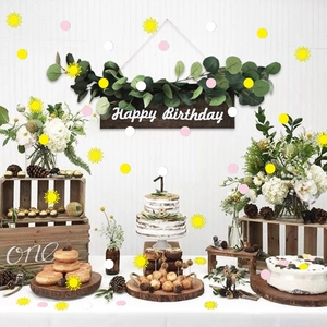 Solar themed confetti set with yellow suns and pink round paper discs for party decor