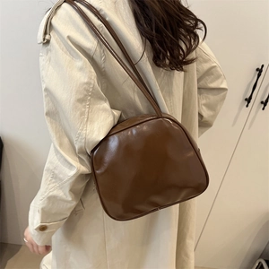 Deep brown glossy patent leather shoulder bag with minimalist rectangular design for women