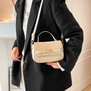 Beige leopard print crossbody handbag with gold lock shown in a casual lifestyle setting
