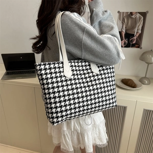 Classic houndstooth tote bag with white leather straps, spacious for daily commuting