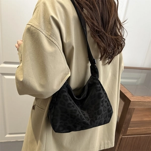 Black leopard jacquard crescent shoulder bag with adjustable strap for women