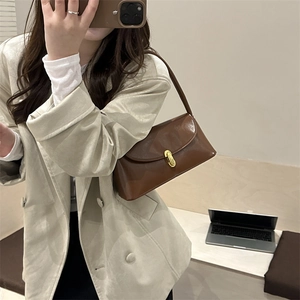 Chic brown glossy leather underarm bag for women with vintage gold turn-lock closure