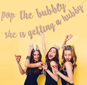 Rose gold glitter banner with Pop the Bubbly text for bridal shower party decorations