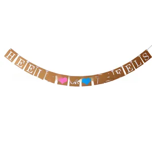Detail of Heels or Wheels gender reveal banner made of vintage kraft paper material