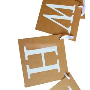 Close-up of kraft paper bunting banner with white letters H and W for baby shower
