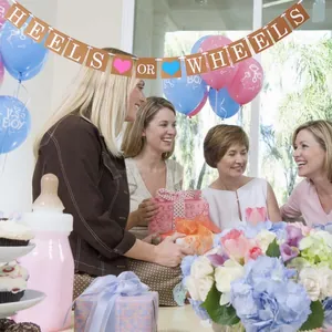 Gender reveal party banner with heels or wheels text and decorative baby balloons