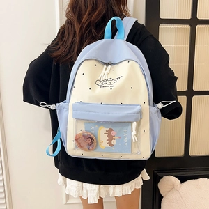 Sweet light blue polka dot backpack with a transparent PVC front pocket for charms