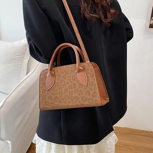 Fashionable leopard print crossbody handbag with top handle in classic brown velvet texture