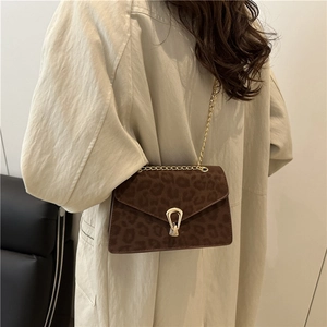 Stylish leopard print crossbody bag with gold chain strap and envelope flap design