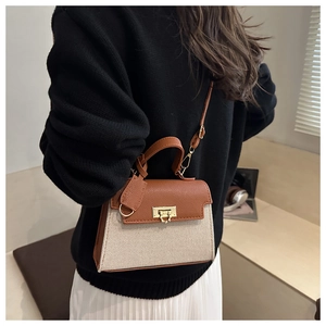 Lifestyle shot of a stylish patchwork crossbody bag worn by a model in a minimalist room