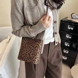 Stylish leopard print bucket crossbody bag for women with leather strap and matte finish