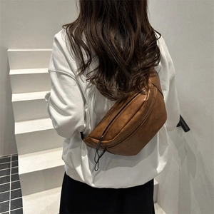 Retro brown faux leather crossbody chest bag for women with minimalist half-moon design