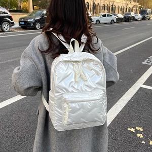 Chic white metallic quilted backpack for women featuring a puffy padded design and casual style
