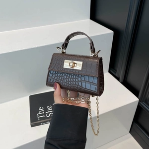 Mini dark brown crocodile embossed handbag with gold twist lock and chain strap