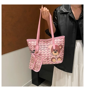 Pink tote bag with bear print and small pouch shown from a high-quality side-view perspective