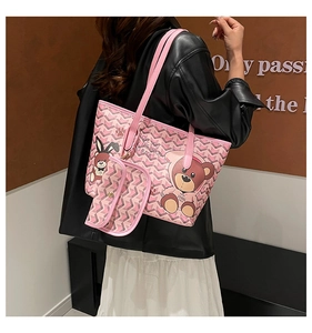 Detail of pink cartoon bear tote bag with wavy patterns and comfortable shoulder straps