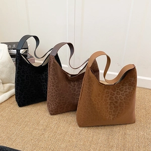 Large leopard print faux fur hobo tote bag in three colors for winter styling