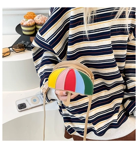 Detail of creative umbrella-shaped crossbody bag with vibrant multi-color patchwork design