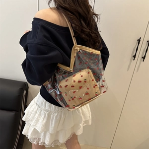 Transparent PVC cherry print tote bag with brown inner pouch and leather trim straps