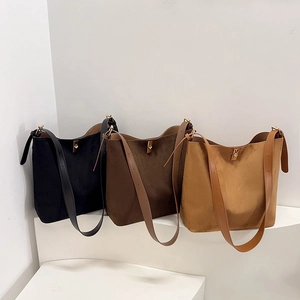 Minimalist faux suede bucket bags with gold twist locks in black and brown colors