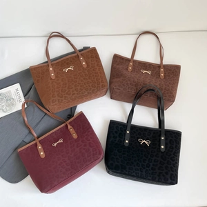 Chic leopard print large tote bags with golden bow accent in four classic colors
