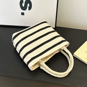 Classic black and white striped canvas tote bag with thick handles and minimalist design