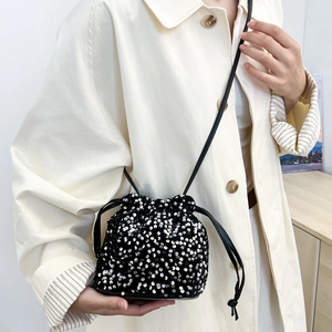 Fashionable black sequin bucket bag with drawstring closure for winter party style