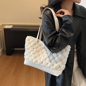 White textured faux fur tote bag with long leather straps for 2025 winter fashion