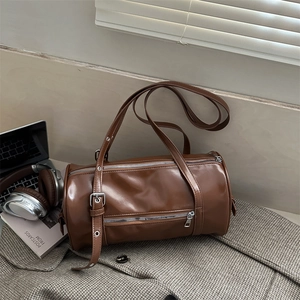 Retro dark brown cylinder shoulder bag with silver hardware and adjustable strap