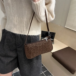 Chic leopard print faux suede shoulder bag with brown leather strap and silver hardware