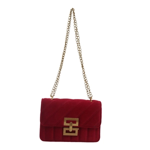 Quilted red velvet crossbody bag with elegant gold chain strap and geometric lock