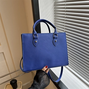 Large dark blue Saffiano tote bag with gold hardware and adjustable strap