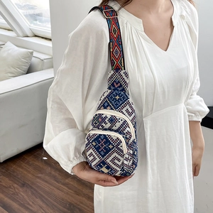 Ethnic bohemian sling bag with geometric weave pattern and colorful strap for women