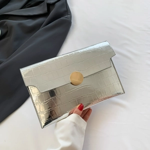 Silver envelope clutch bag with crocodile texture and round gold metal buckle