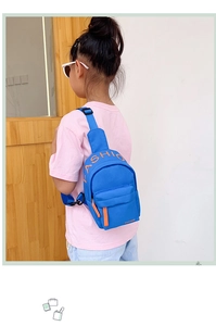 Blue kids nylon crossbody chest bag with orange FASHION text and zip pocket