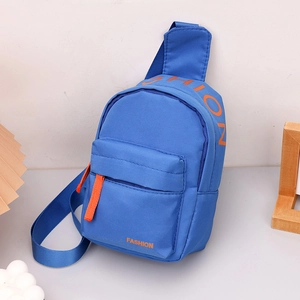 Detail of blue nylon kids' chest bag featuring orange 'FASHION' text and zipper pocket