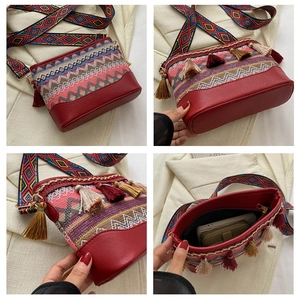 Detailed view of bohemian crossbody bag with colorful tassels and spacious interior