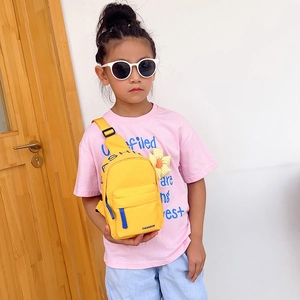 Kids yellow nylon chest bag with adjustable strap and sunflower charm for daily outings