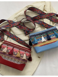Ethnic style woven shoulder bag with colorful tassels and patterned crossbody strap