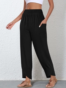 Women's high waist black linen pants with unique petal-shaped slit hem and elastic waist