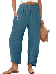 Detail of high waisted cotton linen wide leg trousers featuring a unique tulip hem design