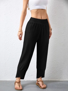 Women's black high-waist cotton linen pants with cargo pockets and tulip hem cuffs