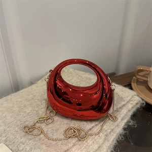 Metallic red crescent handbag with golden chain strap for evening events and parties