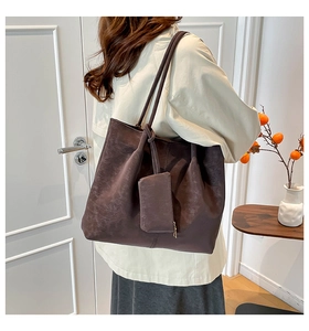 Detail view of retro dark brown matte tote bag and matching mini pouch for daily work