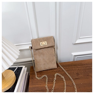 Detail of khaki corduroy quilted mini bag with gold chain strap and turn-lock closure